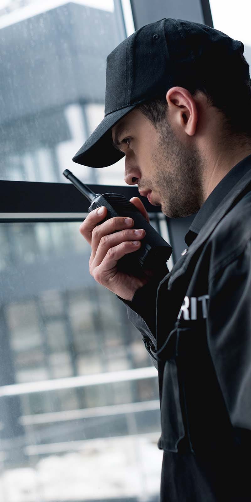 handsome-guard-in-black-uniform-talking-on-walkie-GDJCVQ4.jpg handsome-guard-in-black-uniform-talking-on-walkie-GDJCVQ4.jpg